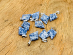 Blue Spot Jasper triangle gemstone pendant featuring a geometric design, crafted by GemstoneGO.