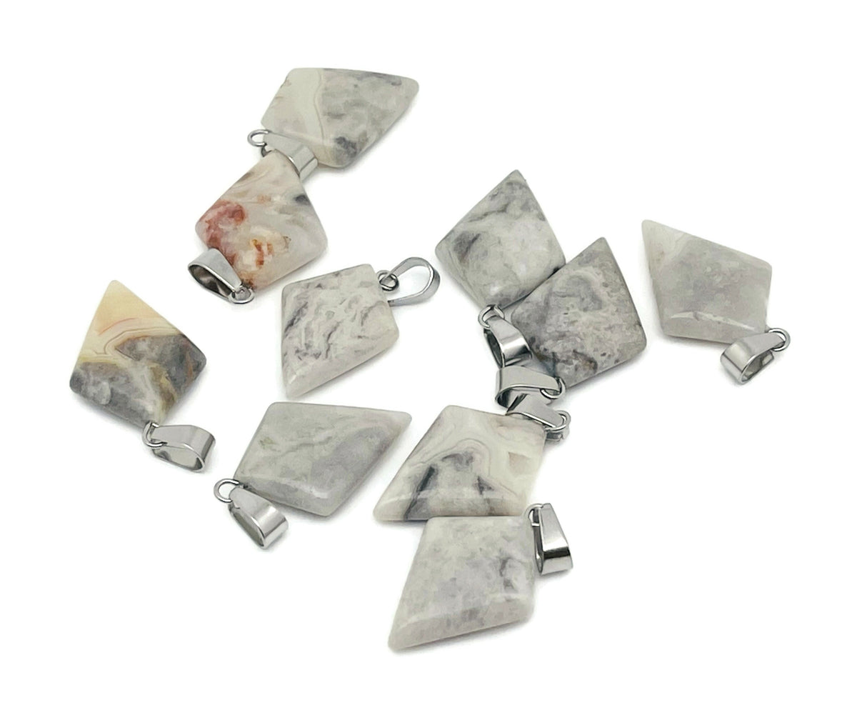 Crazy Lace Agate triangle gemstone pendant with geometric design, showcasing vibrant banded patterns, crafted by GemstoneGO.