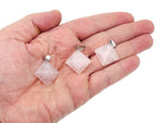 Natural rose quartz pyramid gemstone pendant, showcasing a polished pink crystal pendant from GemstoneGO.