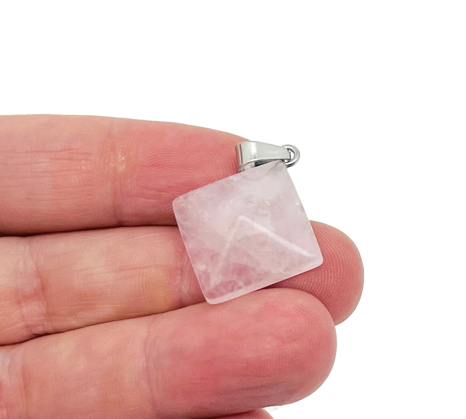Rose quartz pyramid gemstone pendant from GemstoneGO, showcasing a natural pink pyramid-shaped crystal jewelry piece.