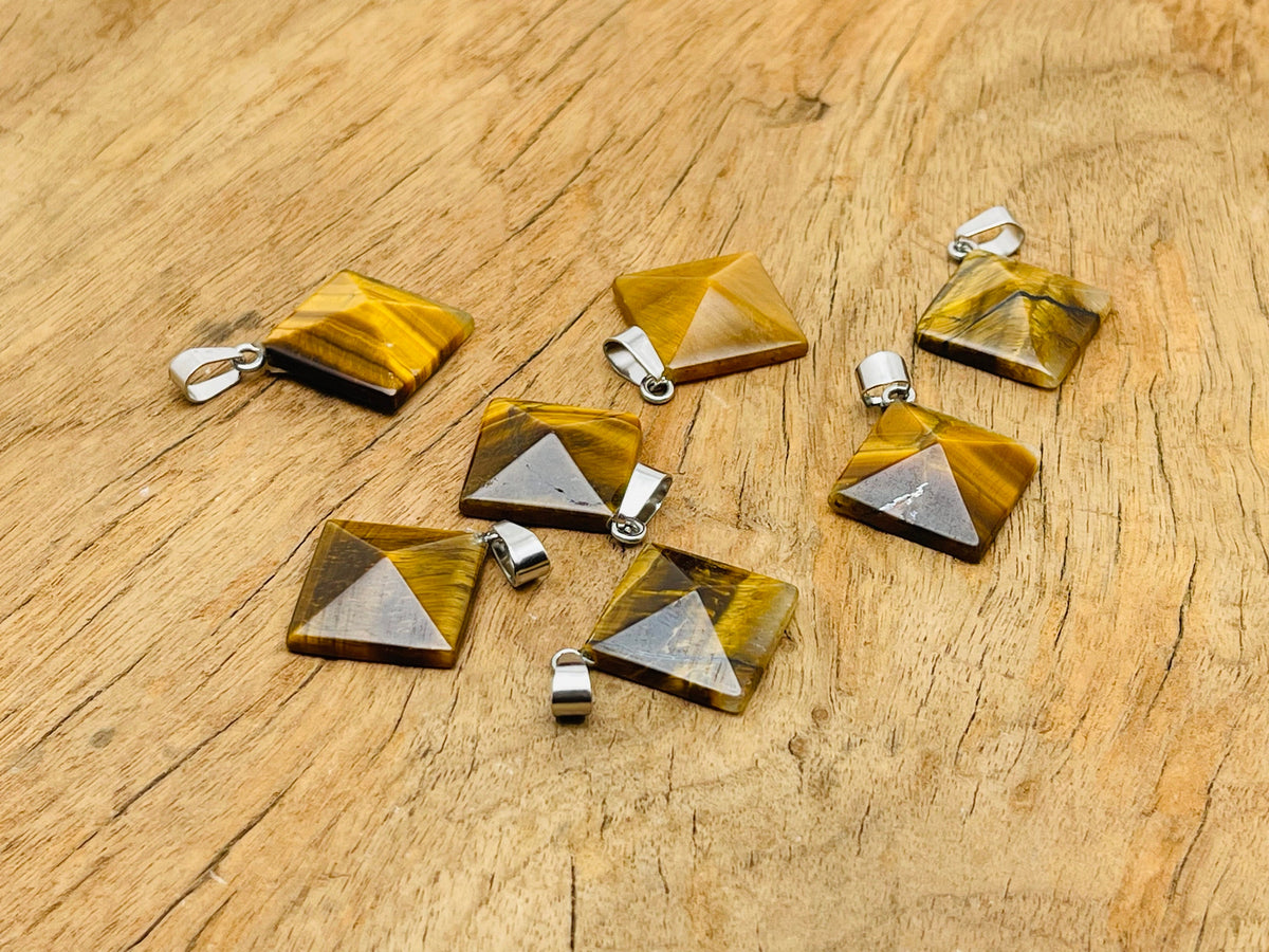 Tiger Eye pyramid gemstone pendant from GemstoneGO, showcasing a polished natural gemstone with a pyramid shape and rich golden-brown color.