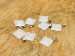 Natural clear quartz pyramid gemstone pendant from GemstoneGO, showcasing a polished, light-reflecting geometric jewelry piece.