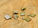 Unakite pyramid gemstone pendant from GemstoneGO, showcasing a natural green and pink stone with polished facets.