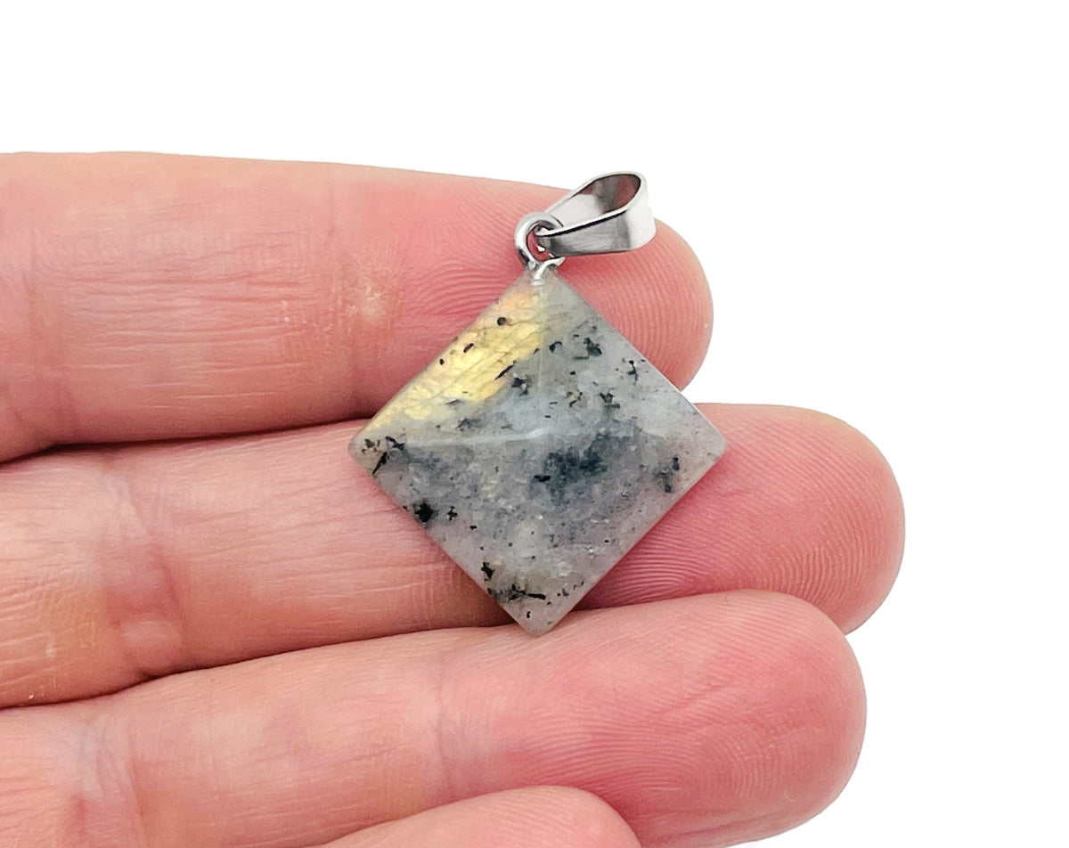 Labradorite pyramid gemstone pendant from GemstoneGO featuring a natural, polished gemstone on a silver chain.