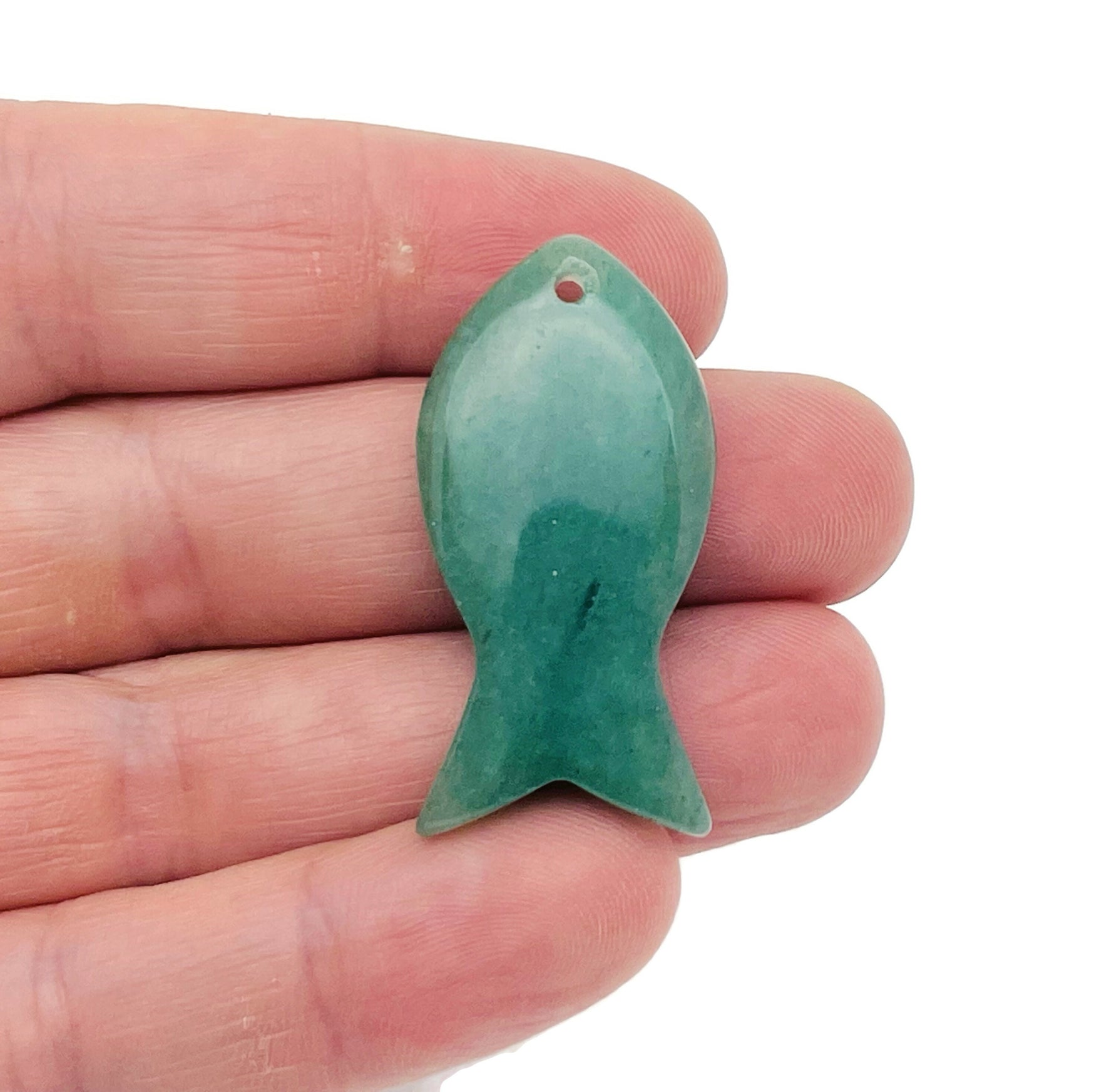 Aventurine fish-shaped gemstone pendant featuring a Pisces zodiac hole design, crafted by GemstoneGO.
