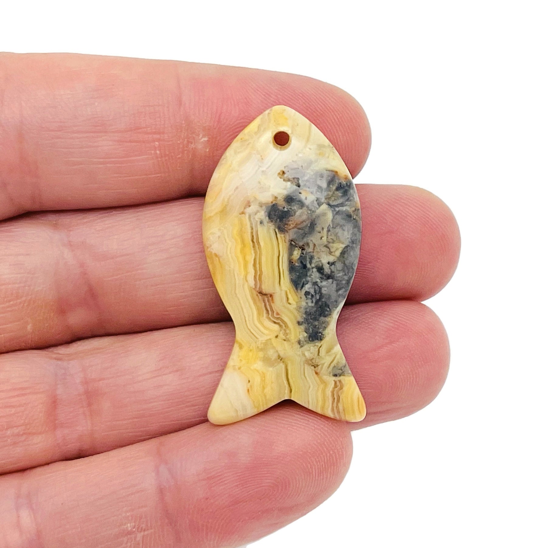 Crazy Lace Agate fish-shaped gemstone pendant with Pisces zodiac hole crystal, crafted by GemstoneGO.