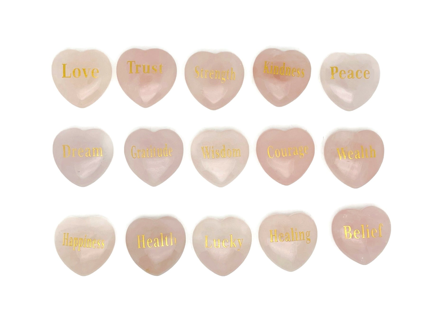 Rose Quartz heart engraved crystal by GemstoneGO, symbolizing love, trust, strength, kindness, peace, and happiness.