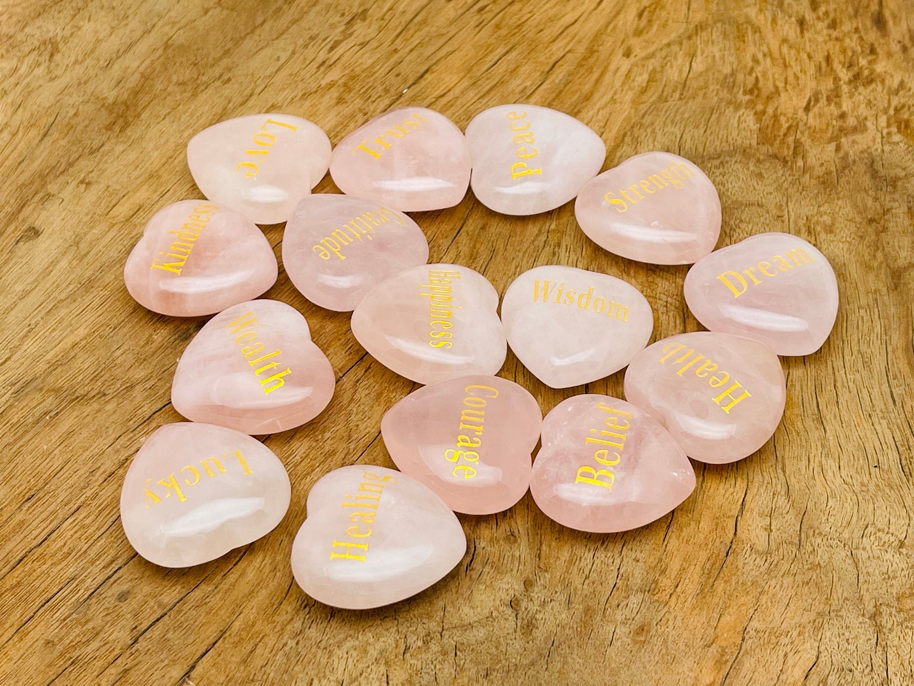 Rose Quartz Heart engraved crystal by GemstoneGO, featuring symbols of love, trust, strength, kindness, peace, and happiness.