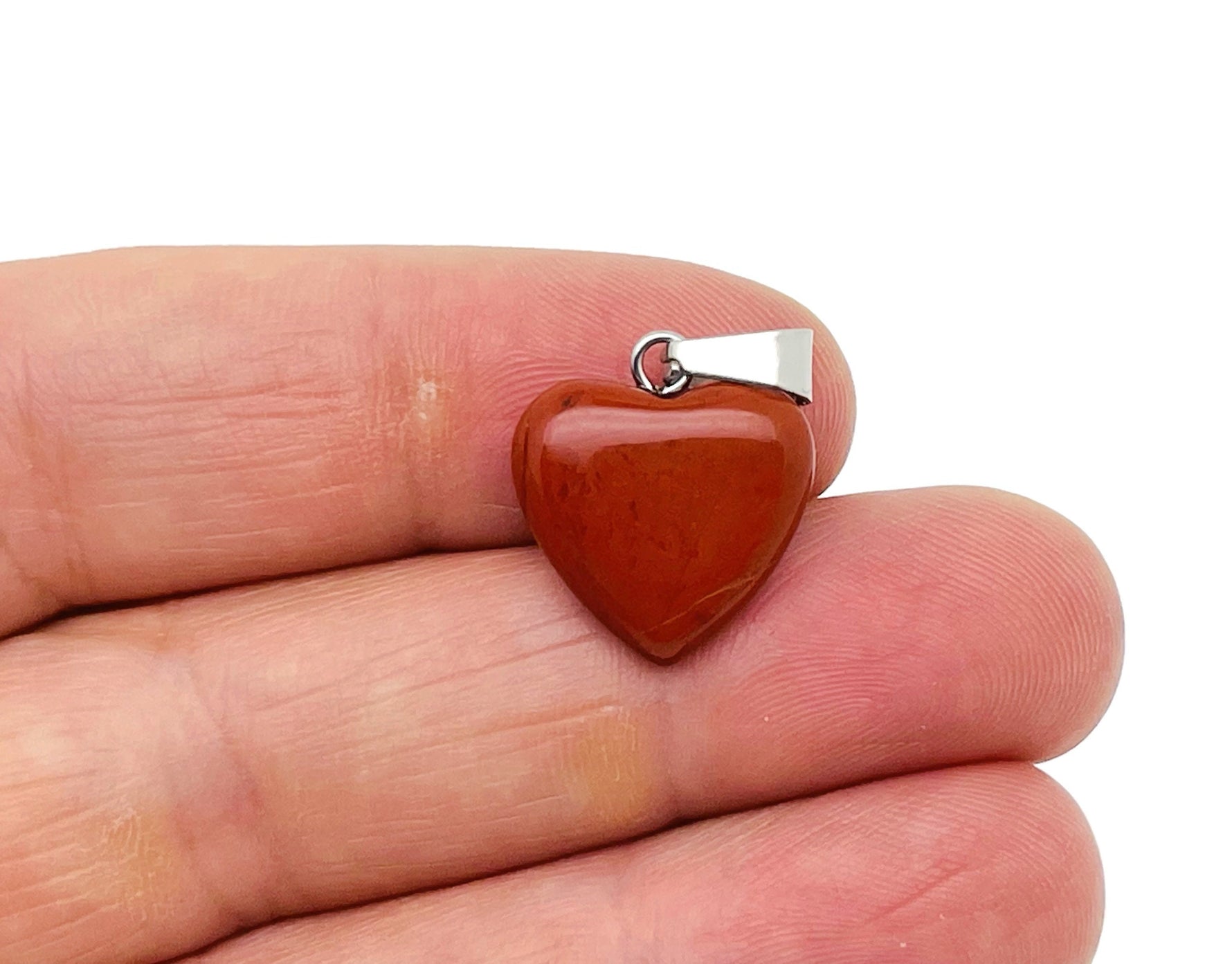 Red Jasper heart pendant by GemstoneGO featuring a mini crystal design on a silver chain.