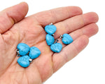 Turquoise heart-shaped pendant with mini crystal accents from GemstoneGO, showcasing detailed jewelry craftsmanship.