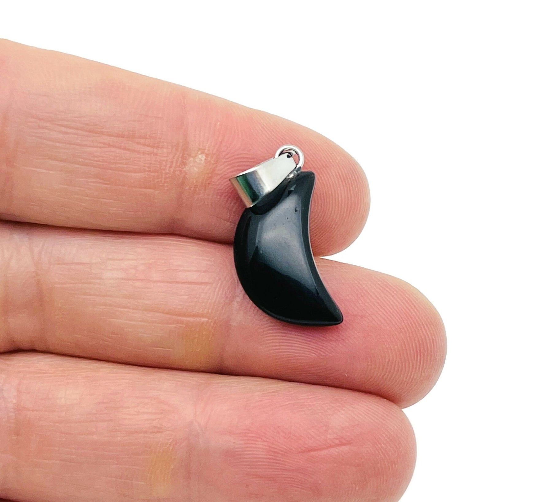 Obsidian moon crystal pendant from GemstoneGO, showcasing a polished black gemstone with moon design for jewelry making.