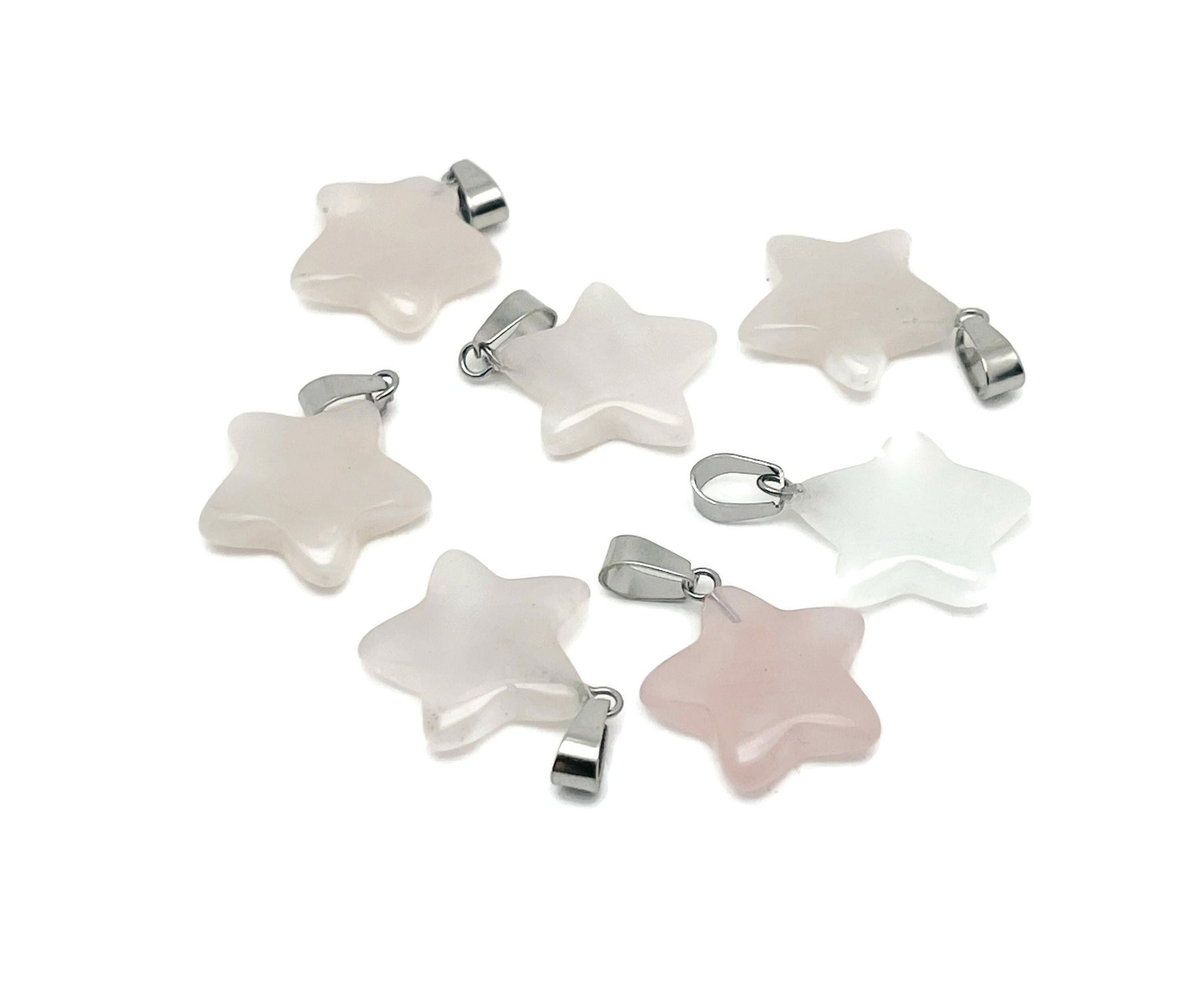 Rose quartz star pendant from GemstoneGO, showcasing a crystal jewelry piece with a polished pink star-shaped gemstone.