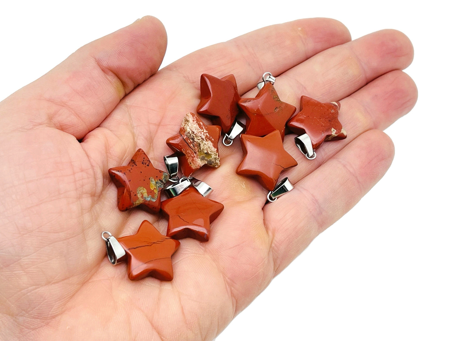 Red Jasper star pendant from GemstoneGO with a polished crystal finish, ideal for jewelry making supplies.