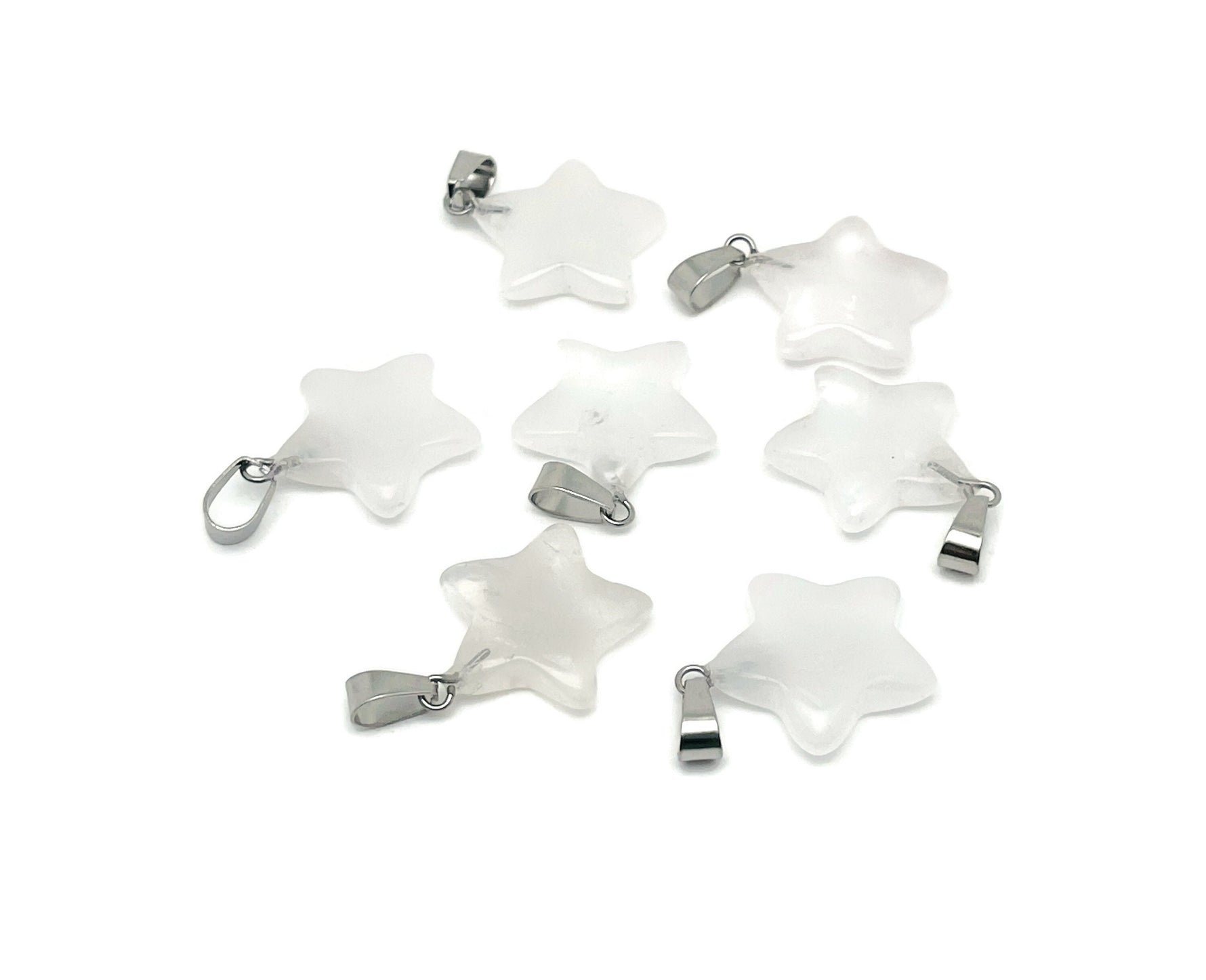 Clear quartz star pendant from GemstoneGO, a sparkling crystal jewelry making supply with a polished star shape.