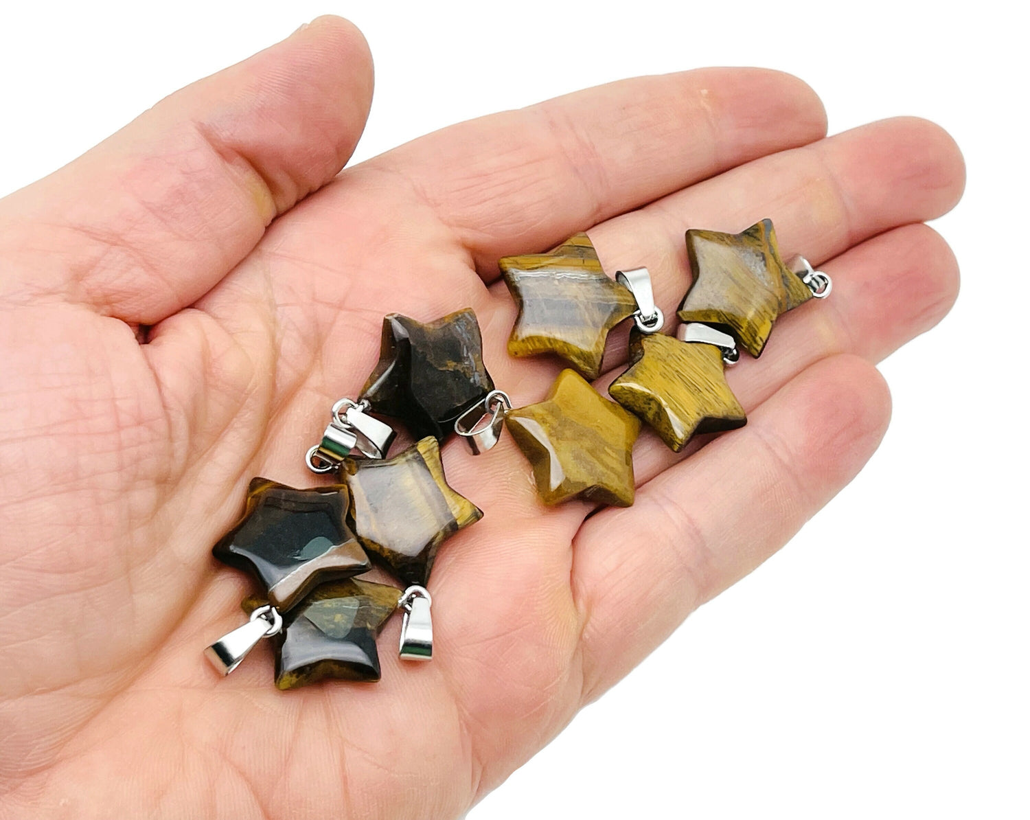 Tiger Eye star pendant from GemstoneGO, a polished crystal jewelry-making supply featuring a star-shaped design.