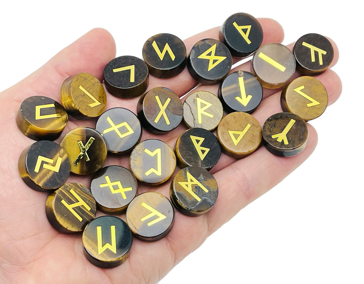 Set of 25 engraved Crystal Rune Stones featuring Elder Futhark alphabet, compact gemstone pocket stones for divination or decoration.