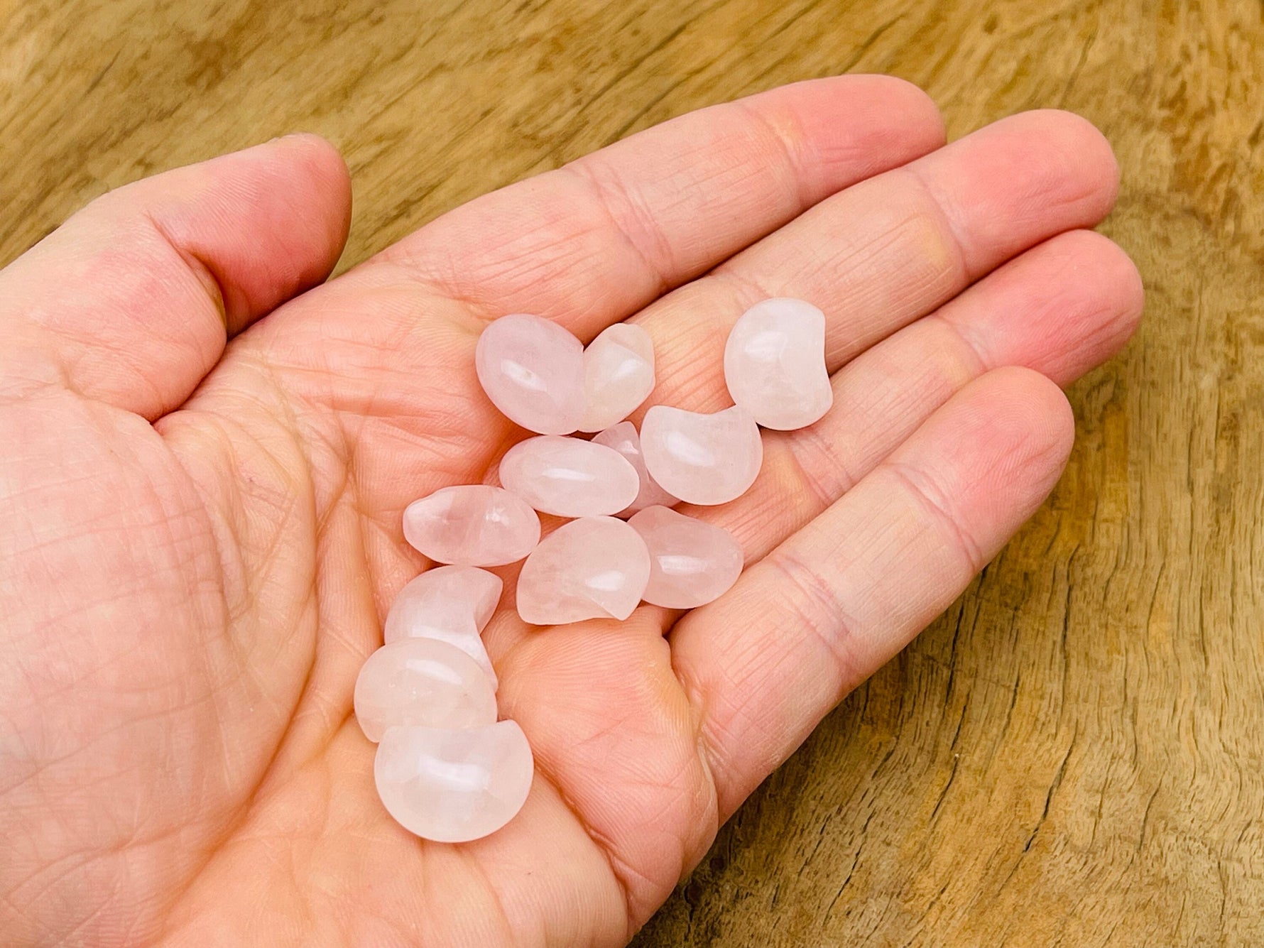 Rose Quartz gemstone moon puffy pendant, 15x9mm, featuring a soft pink hue and smooth, rounded shape from GemstoneGO.