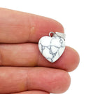 Mini Howlite heart pendant by GemstoneGO featuring a polished white gemstone crystal heart necklace.