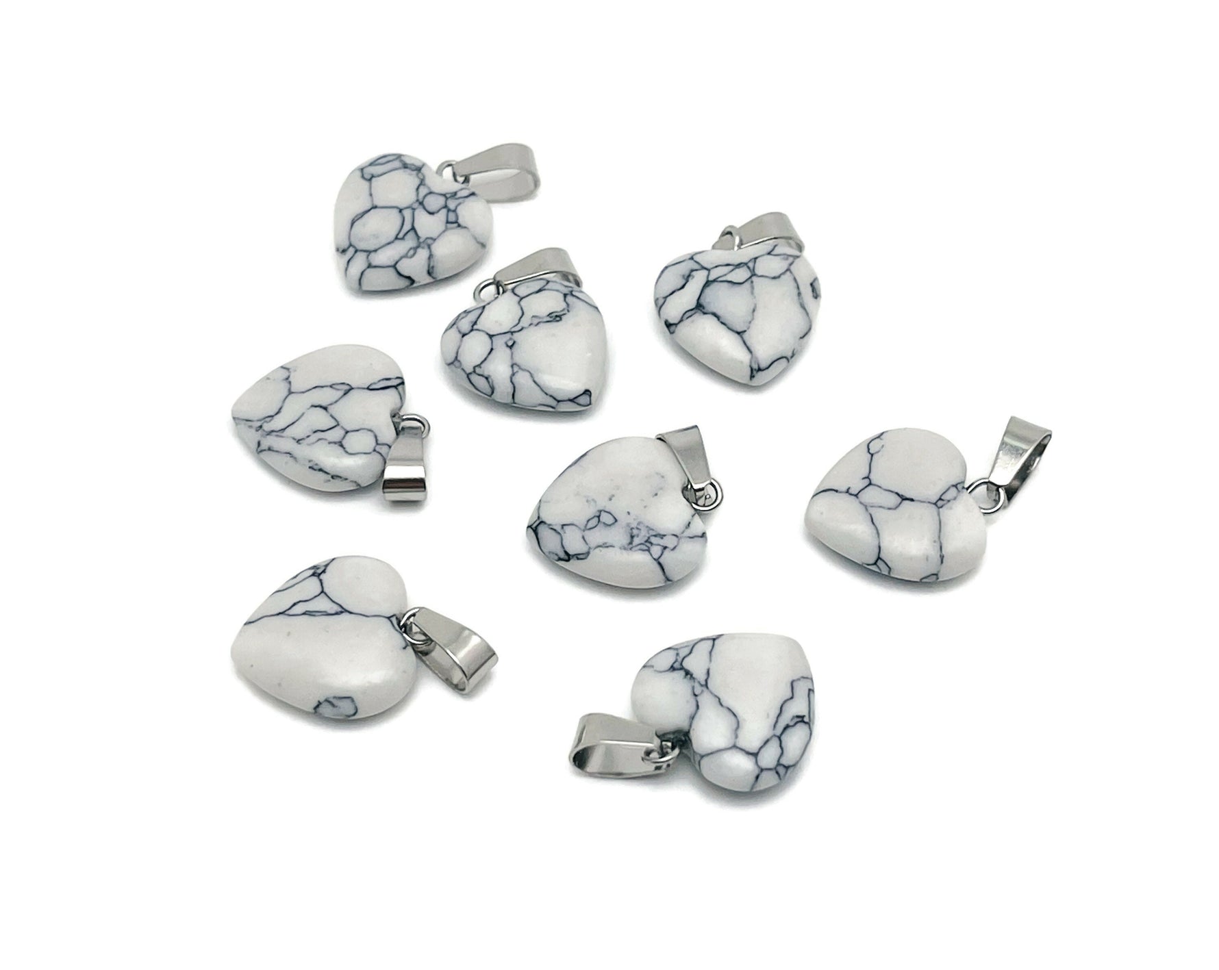 Mini Howlite heart pendant from GemstoneGO featuring a smooth, white gemstone heart crystal for jewelry or accessories.
