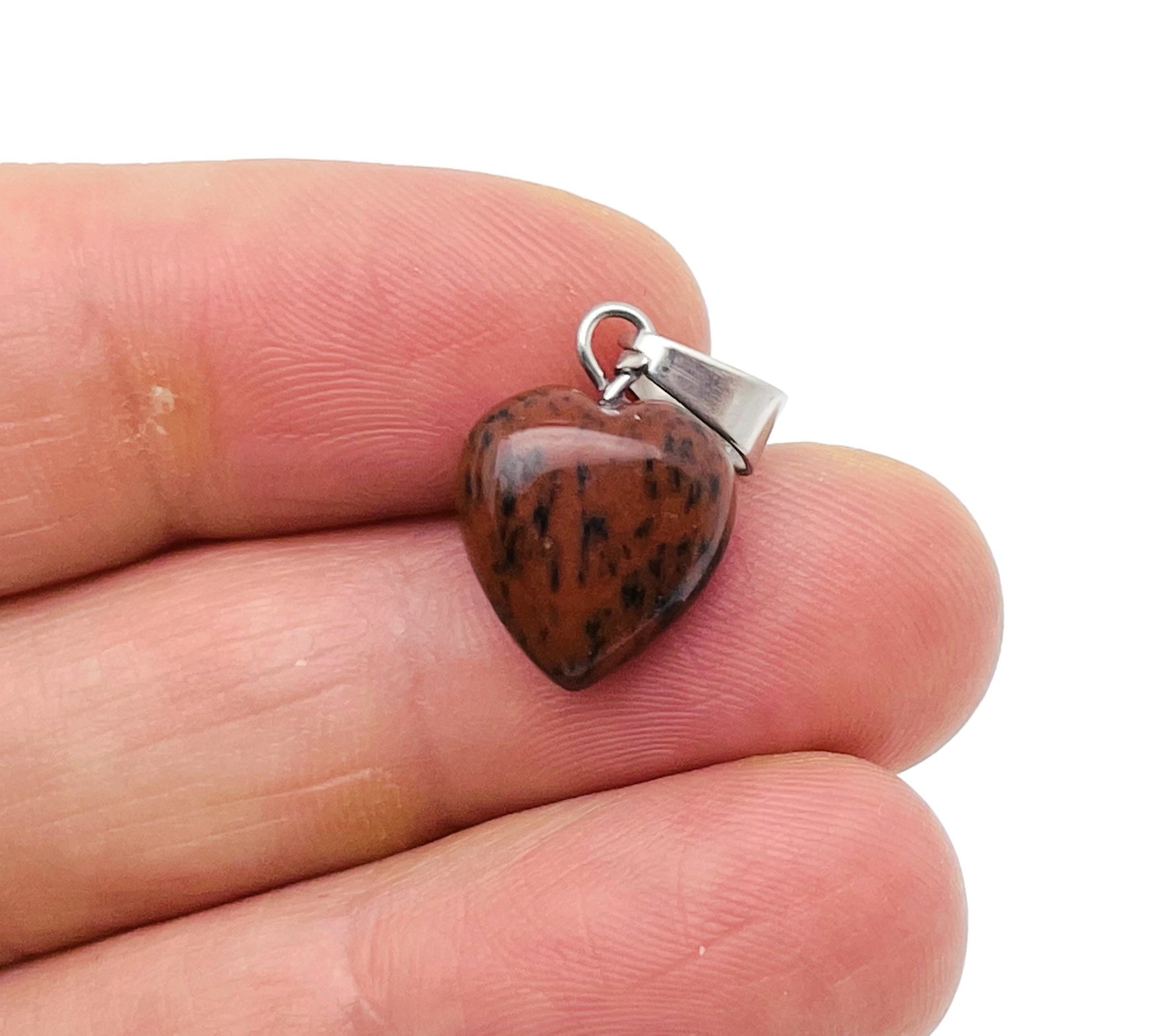 Mini mahogany obsidian heart pendant with a smooth polished surface, crafted by GemstoneGO, perfect for jewelry or accessorizing.