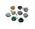 Mini moss agate heart pendant from GemstoneGO, showcasing a polished crystal with natural green and earthy tones.