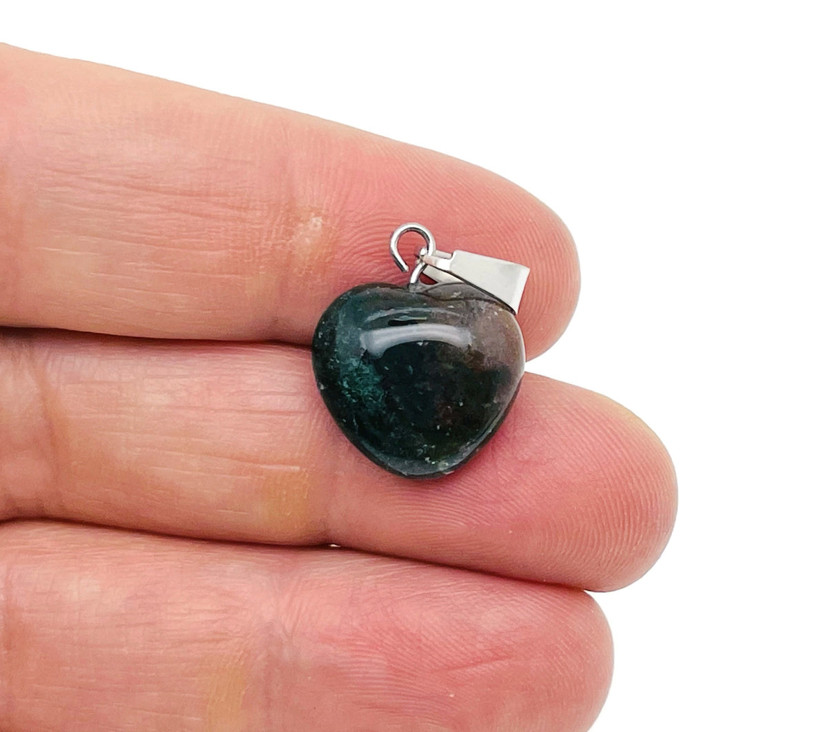 Moss Agate heart-shaped pendant from GemstoneGO featuring a mini crystal pendant with natural green and brown patterns.