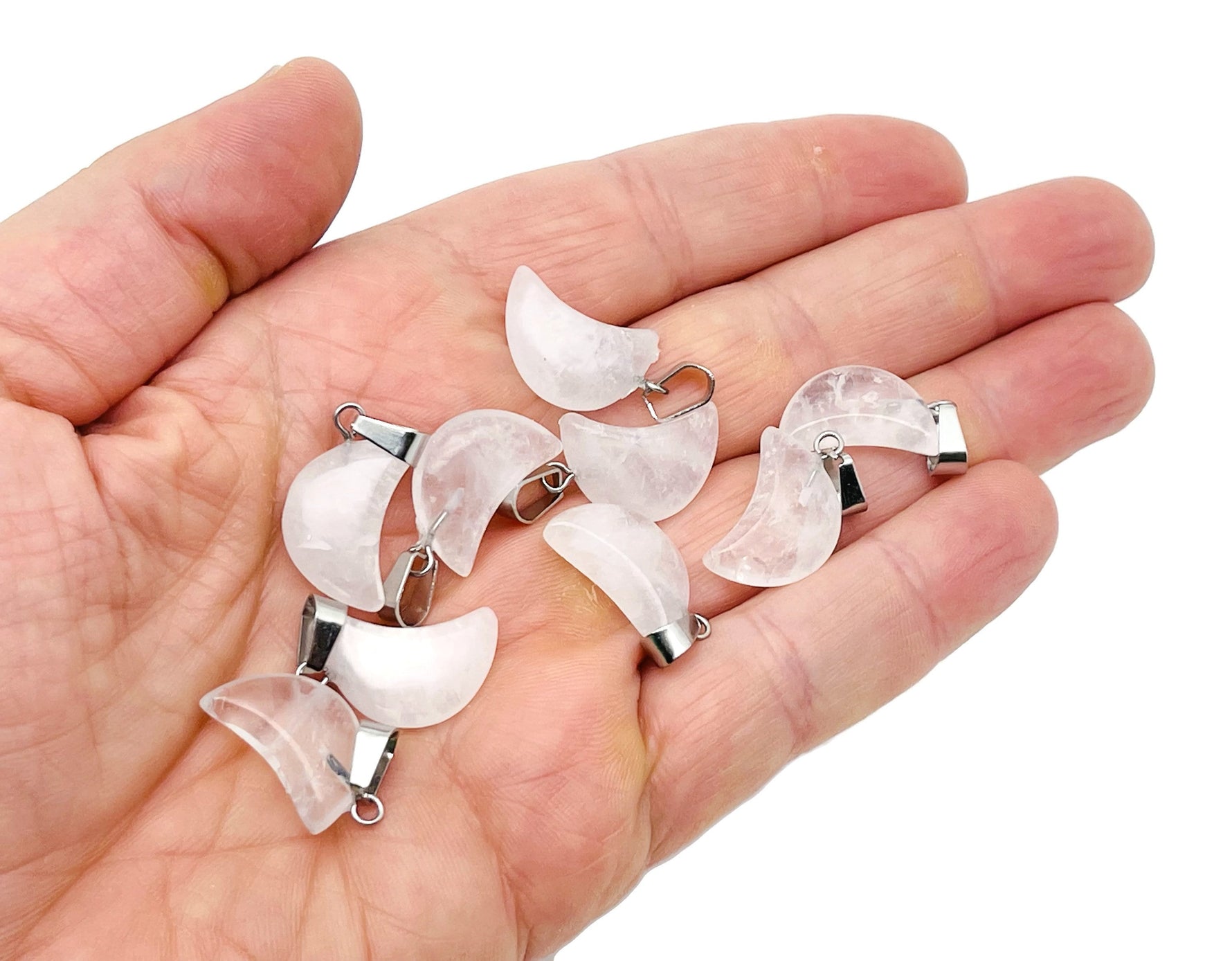 Clear quartz moon-shaped crystal pendant from GemstoneGO, suitable for jewelry making, featuring a polished, luminous stone design.