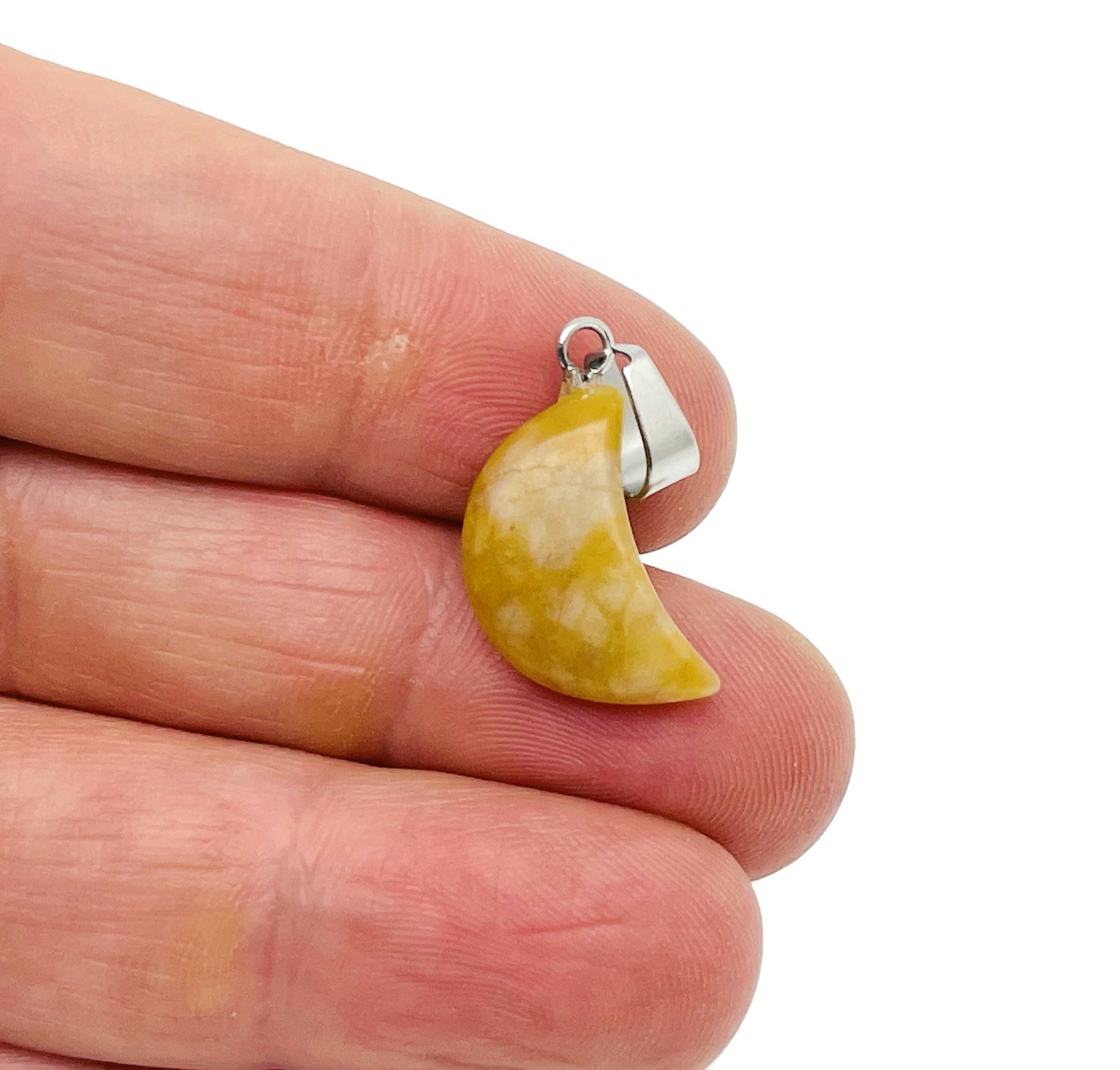 Yellow jade moon crystal pendant from GemstoneGO, showcasing a smooth yellow jade moon-shaped pendant for jewelry making.