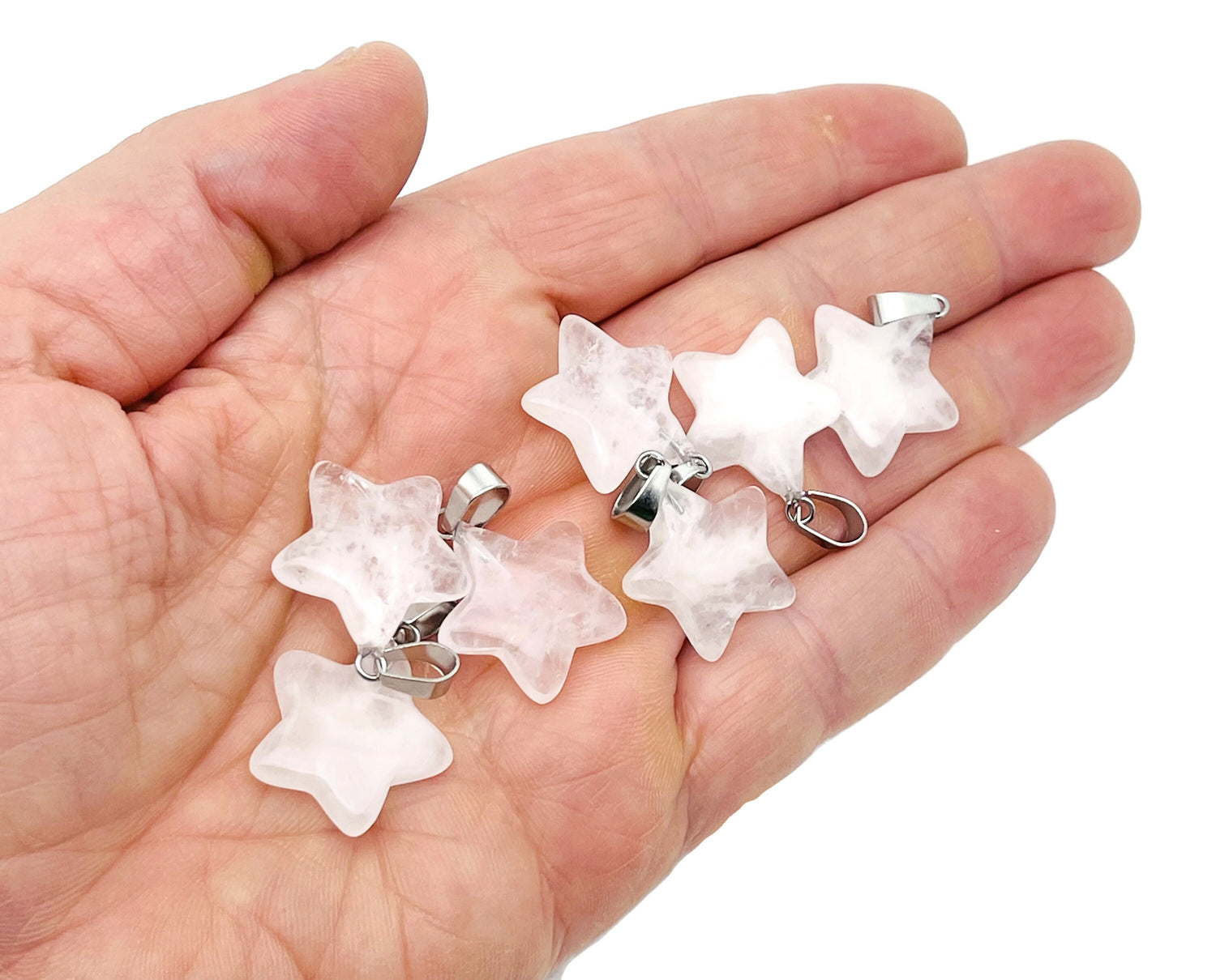 Clear quartz star pendant from GemstoneGO, a sparkling crystal jewelry piece with a silver bail for jewelry making.