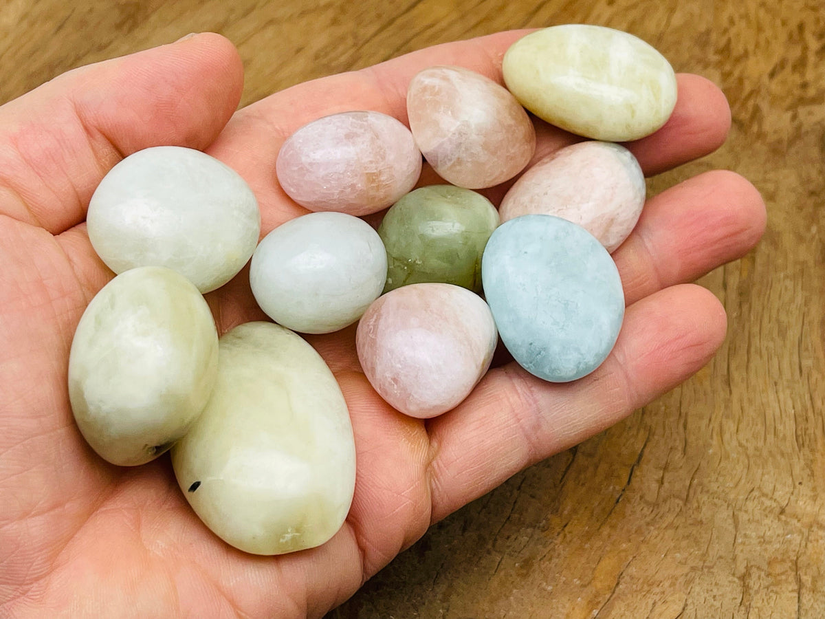 Aquamarine Morganite tumbled gemstone from GemstoneGO showing smooth, polished pinkish-blue mineral with natural variations.