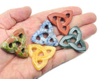 Crystal Celtic knot carved gemstone pendant from GemstoneGO, featuring Trinity Crystal design and various stone options.