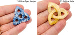 Crystal Celtic Knot carved gemstone pendant from GemstoneGO, featuring Trinity design and assorted colorful stones.