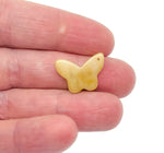 Yellow jade mini butterfly gemstone pendant with hole crystal jewelry, showcasing a delicate butterfly design by GemstoneGO.