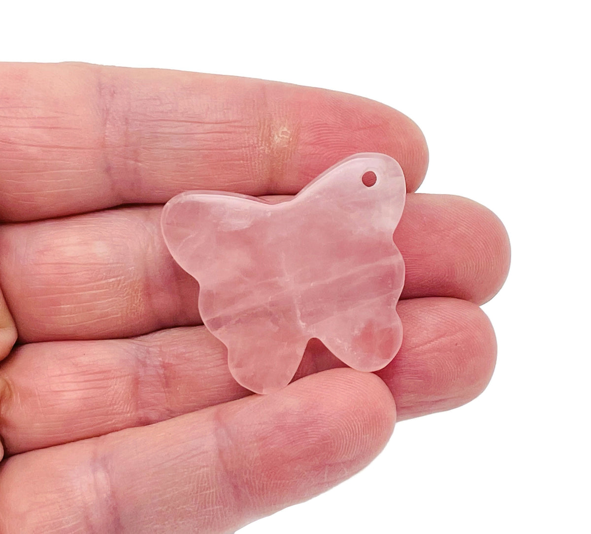 Rose quartz butterfly gemstone pendant with hole crystal jewelry, showcasing a delicate pink quartz butterfly charm.
