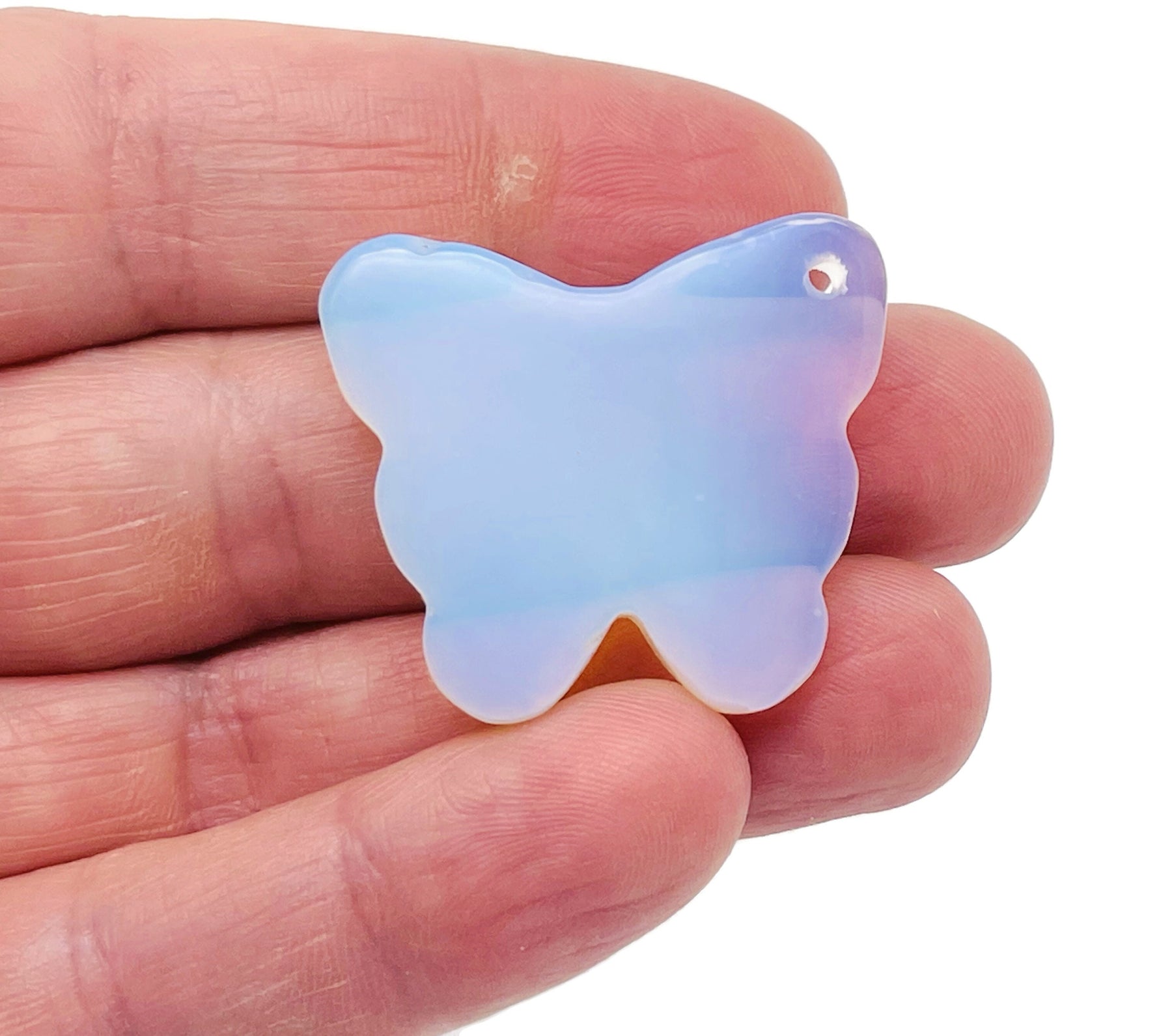 Opalite butterfly gemstone pendant with hole crystal jewelry from GemstoneGO, showcasing a delicate butterfly shape and translucent opalite.