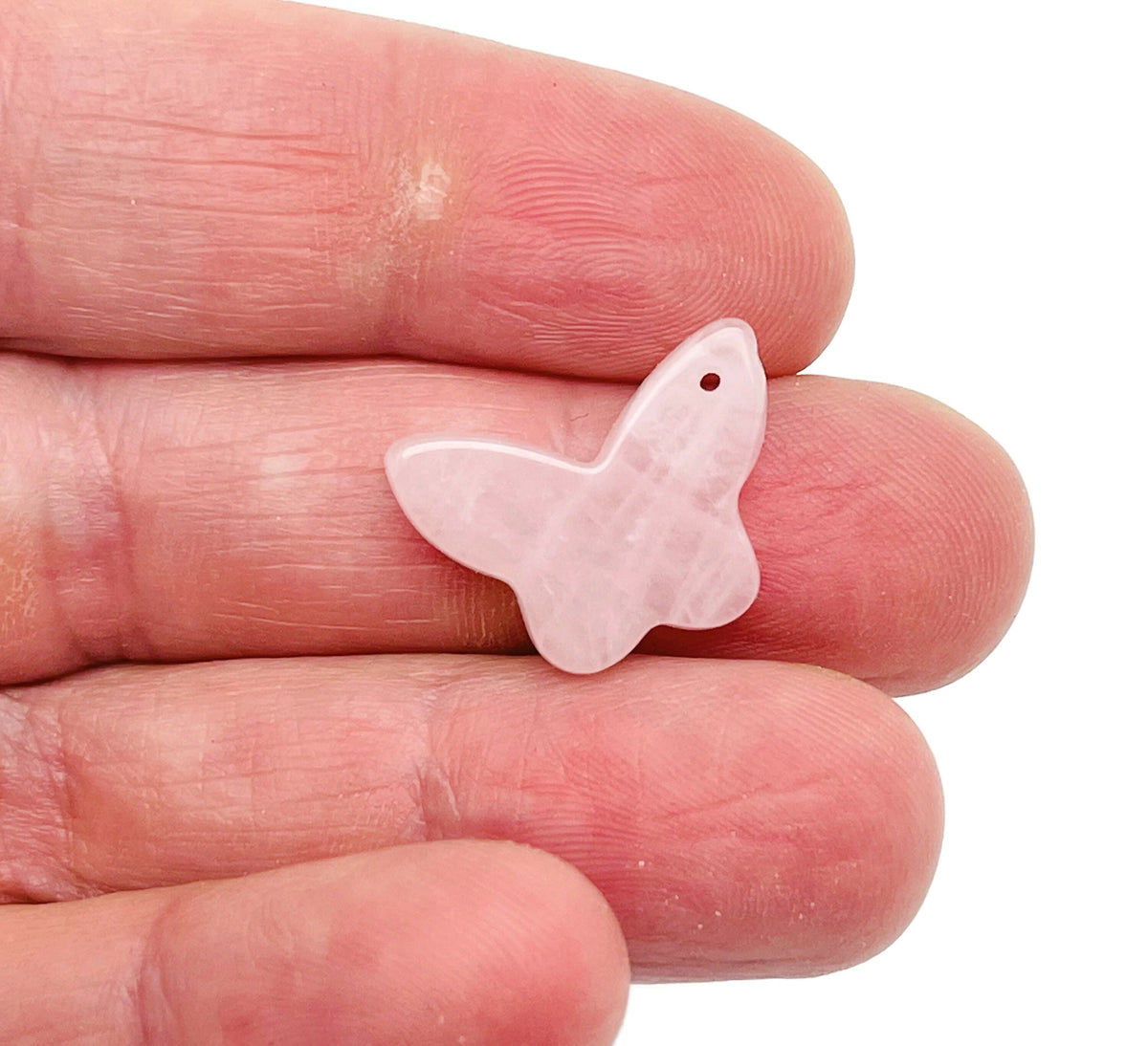 Rose quartz mini butterfly gemstone pendant with hole crystal jewelry, showcasing a delicate pink butterfly design by GemstoneGO.