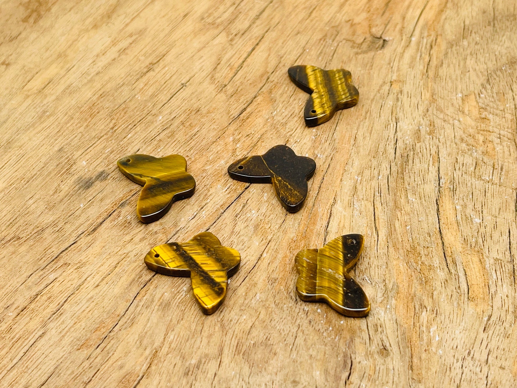 Tiger Eye mini butterfly gemstone pendant with hole for jewelry, featuring warm brown and gold tones, by GemstoneGO.