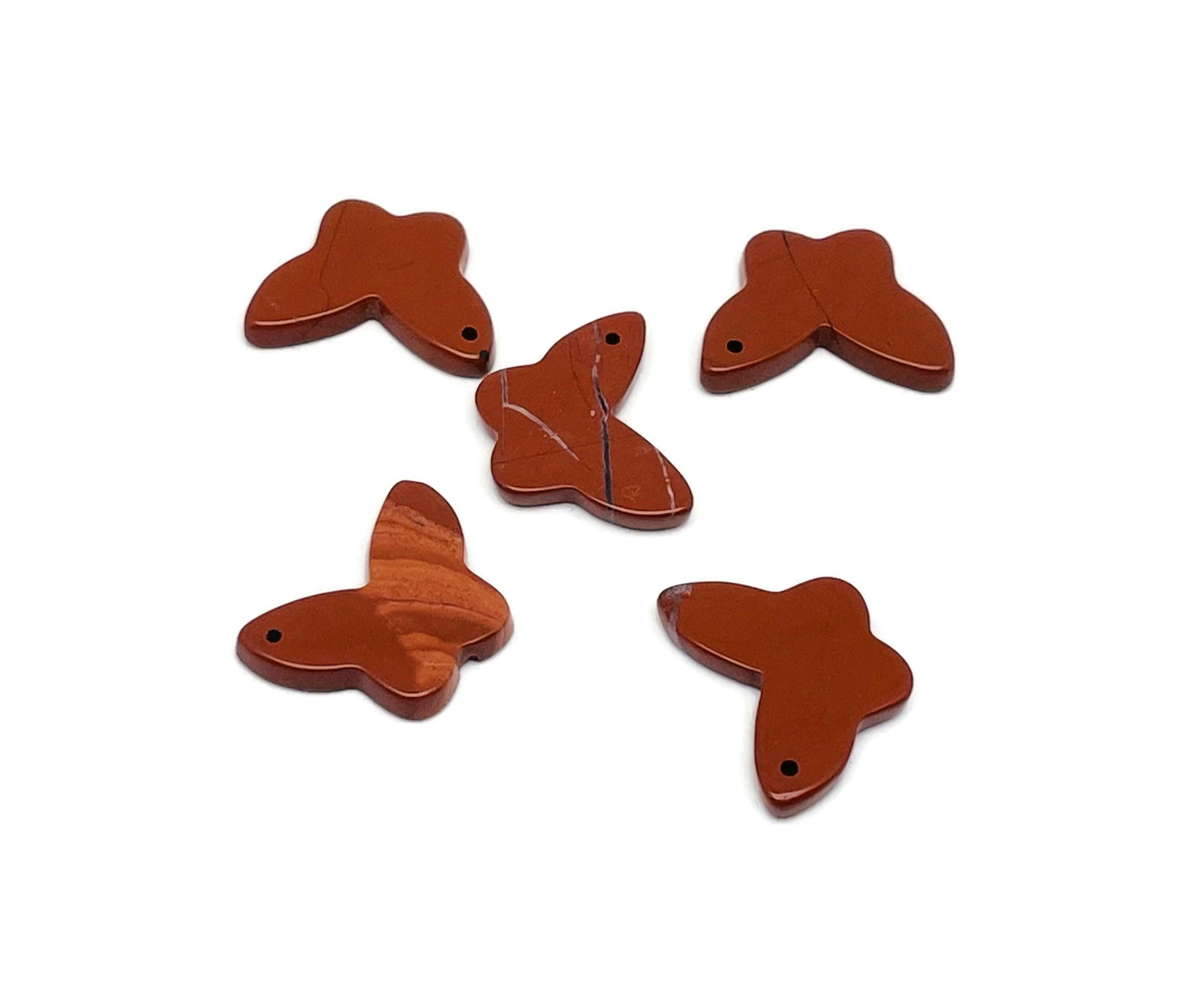 Red Jasper mini butterfly gemstone pendant with hole, showcasing vibrant red color and detailed butterfly shape for crystal jewelry.
