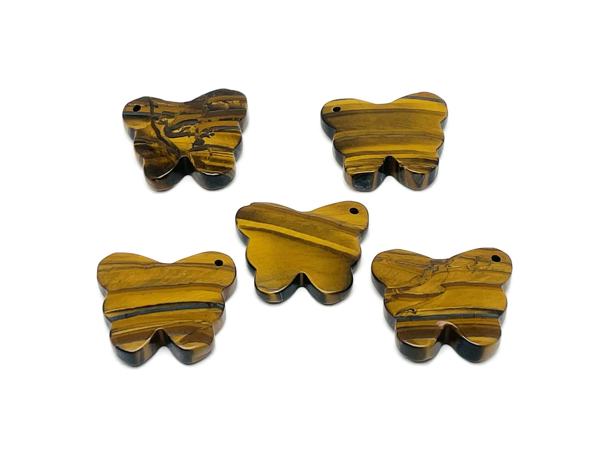 Tiger Eye butterfly gemstone pendant featuring a hole crystal design, jewelry piece by GemstoneGO.