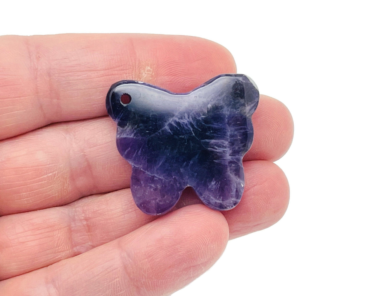 Amethyst butterfly gemstone pendant with hole crystal jewelry from GemstoneGO, showcasing a purple amethyst butterfly design.