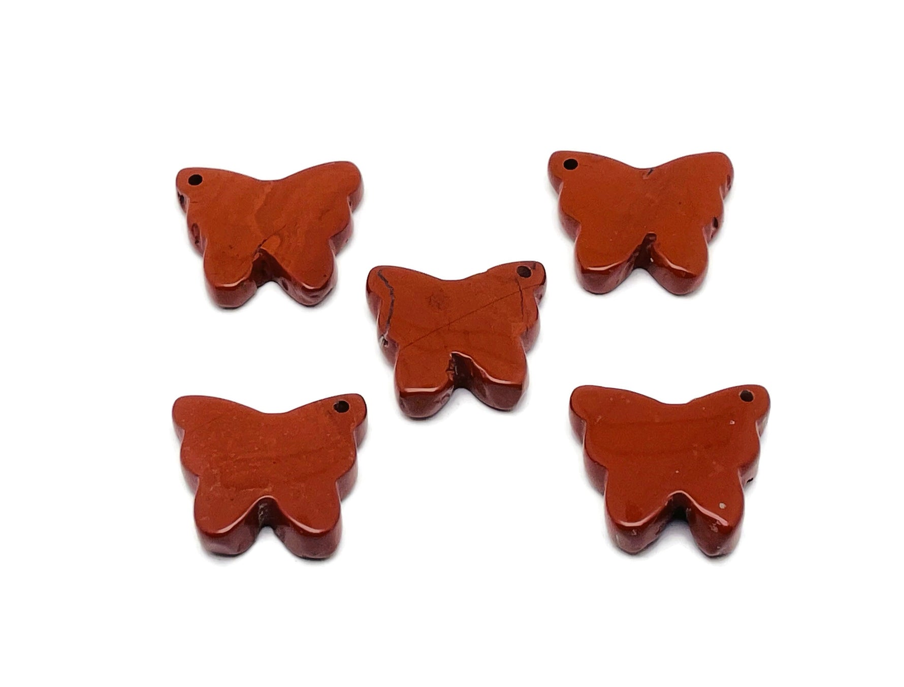 Red Jasper butterfly pendant with hole gemstone jewelry, showcasing vibrant red stone and butterfly shape, handcrafted by GemstoneGO.