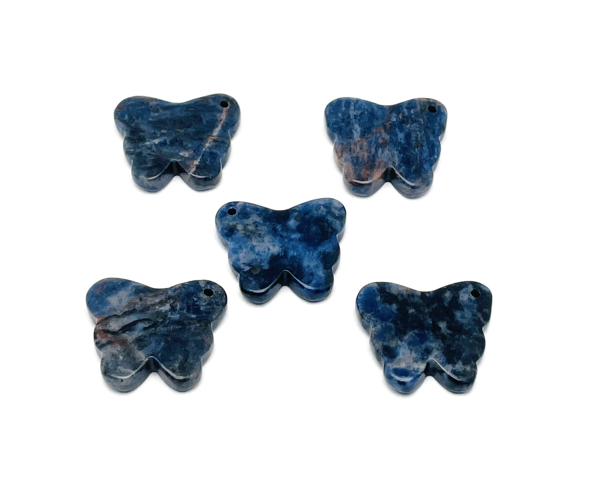 Sodalite butterfly gemstone pendant with hole for jewelry, showcasing vibrant blue and white crystal details on a silver chain