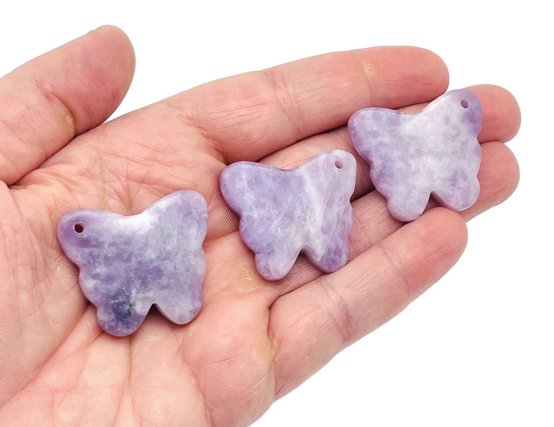 Lepidolite butterfly gemstone pendant with hole for jewelry, showcasing purple and lavender hues, crafted by GemstoneGO.