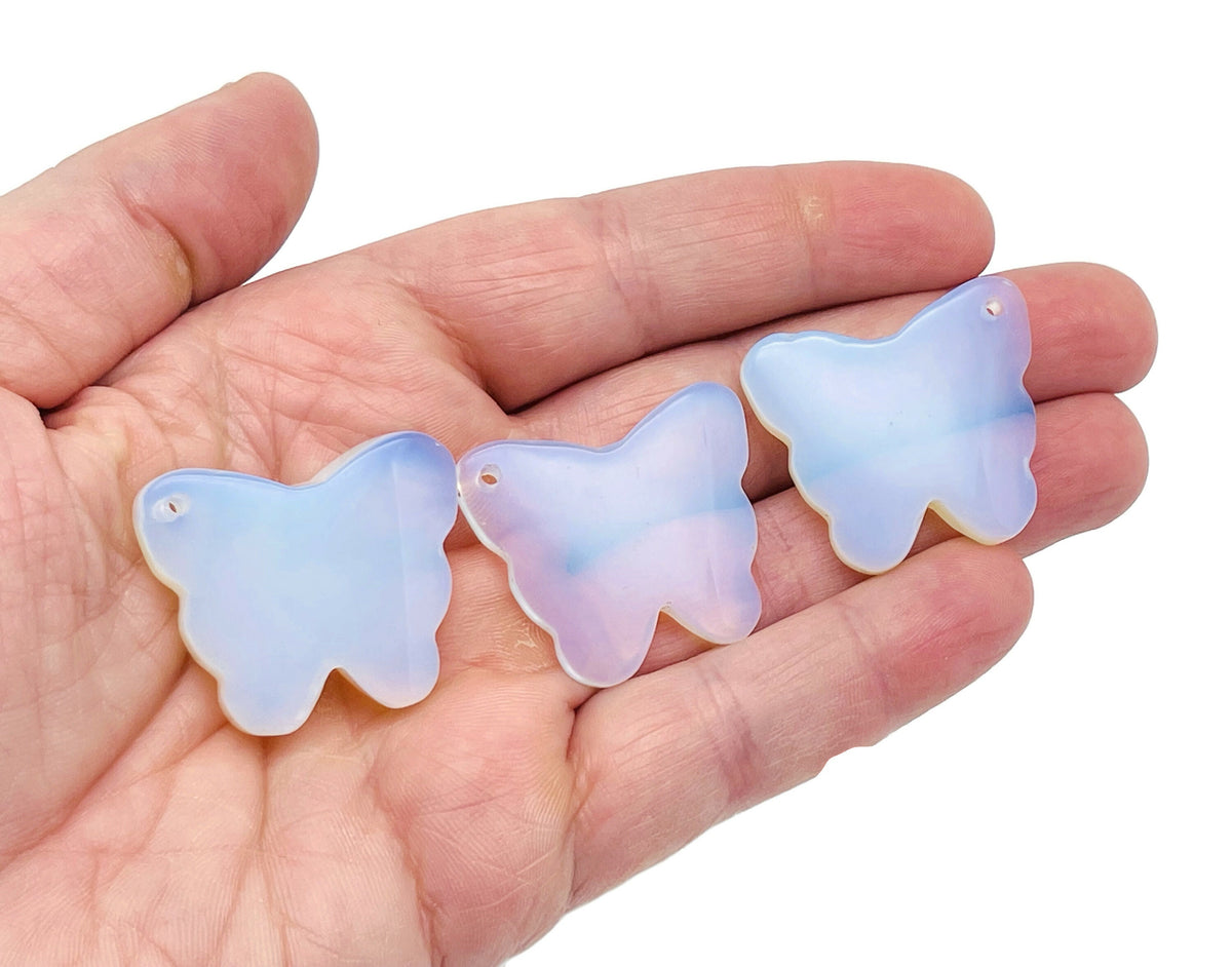 Opalite butterfly gemstone pendant with hole crystal jewelry design, showcasing a delicate butterfly shape and iridescent opalite stone.