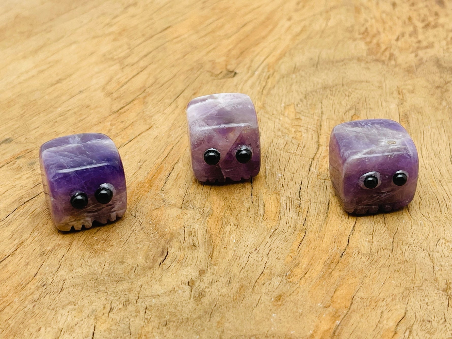 Handmade amethyst gemstone skull carving from GemstoneGO, showcasing detailed purple crystal craftsmanship.