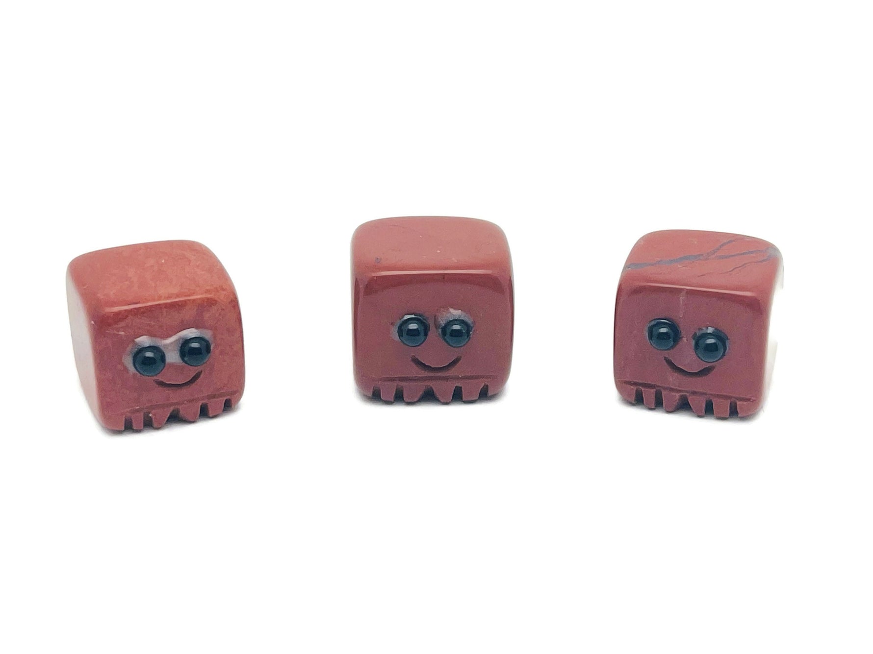 Red Jasper handmade carving skull gemstone from GemstoneGO, showcasing detailed craftsmanship and vibrant red color.