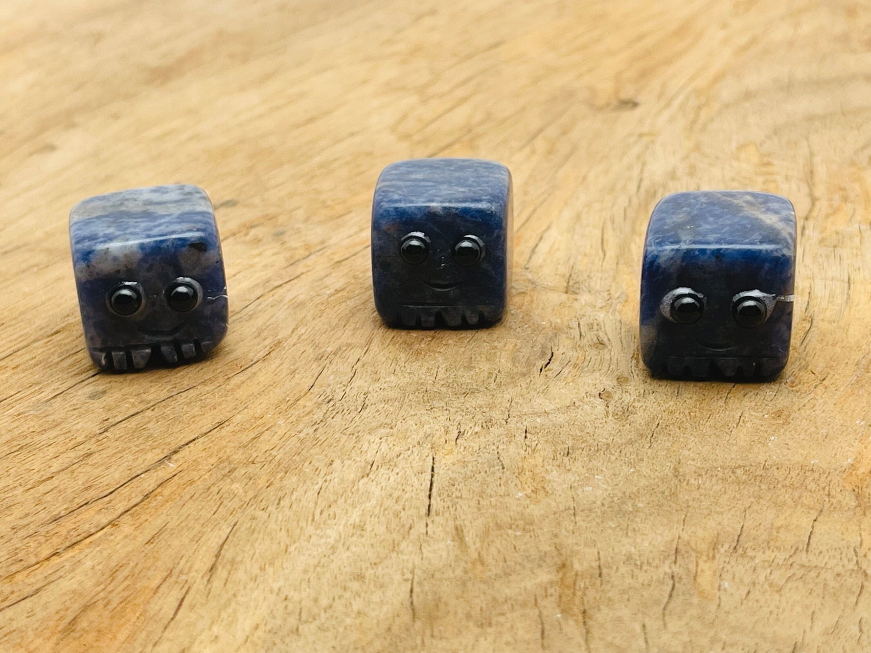 Handmade sodalite gemstone carving skull from GemstoneGO, showcasing blue and white natural stone details.