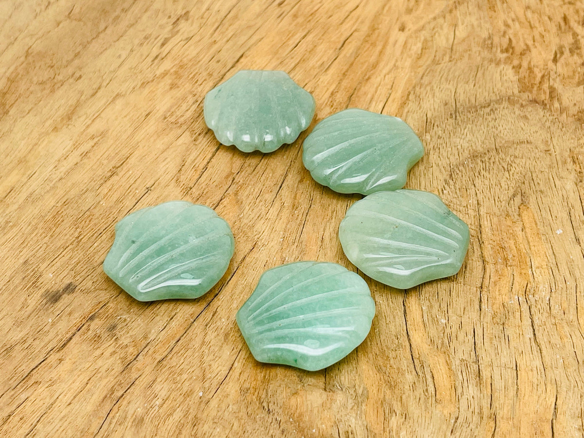 A 30mm Aventurine sea shell gemstone carving from GemstoneGO, showing intricate shell and gemstone details.