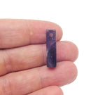 Amethyst crystal pendant from GemstoneGO, drilled for jewelry making, showcasing a purple gemstone with natural facets and a silver bail.