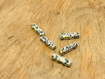 Dalmatian Jasper crystal pendant from GemstoneGO, drilled for jewelry making, showcasing black and cream spotted stone.
